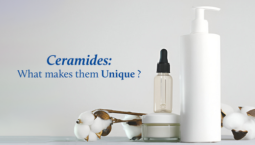 Ceramide skincare products, including serums, creams, and lotions, are displayed on a white table, surrounded by white flowers.